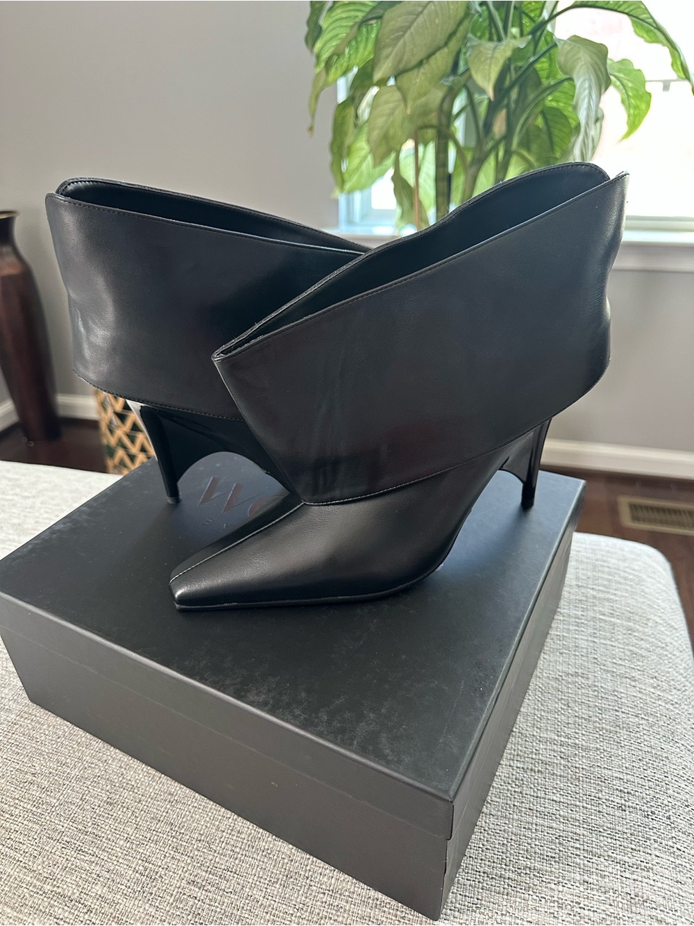 Sleek Black Fold-Over Leather Heeled Booties